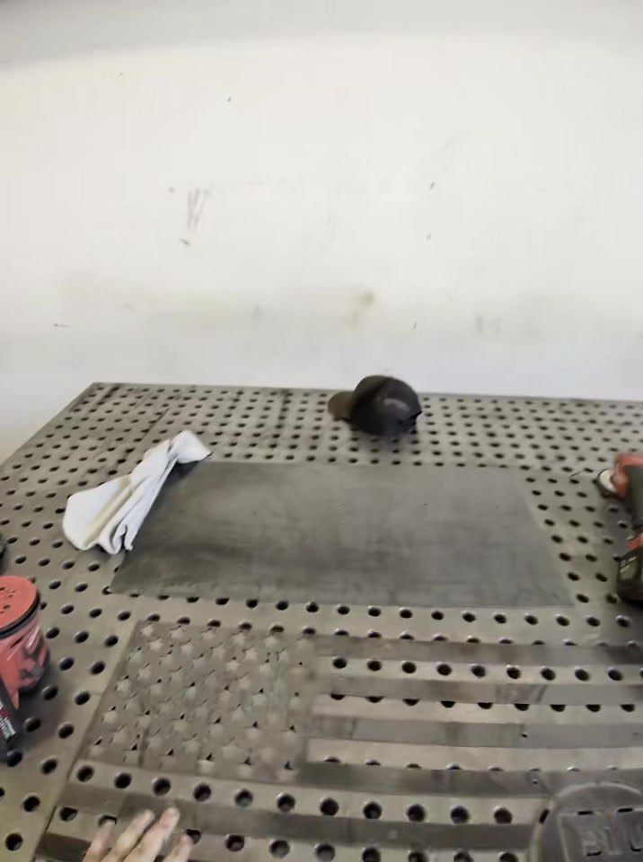 Hand-finishing the star field of a custom steel flag